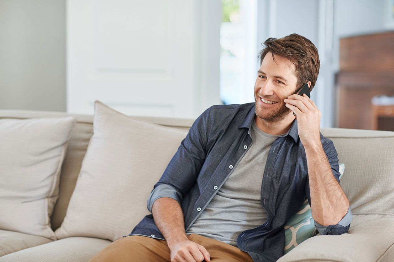 man-on-phone-smiling