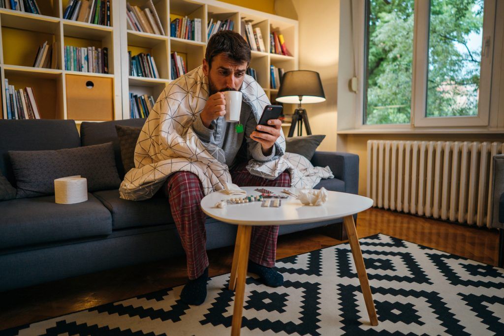 man sick at home