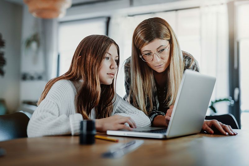 mother-with-girl-on-laptop