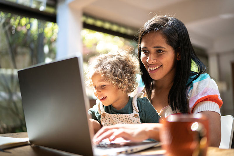 mother-with-child-on-laptop